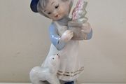 1960s girl with flowers and dog figurine