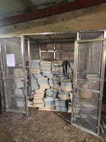 Warehouse shelving and stainless steel cage