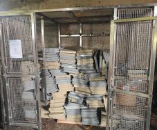 Warehouse shelving and stainless steel cage
