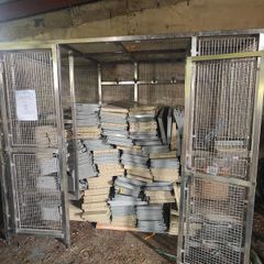 Warehouse shelving and stainless steel cage