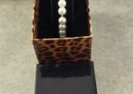 Boxed Jon Richard faux pearl stretch bracelet with a central crystal bead