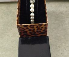 Boxed Jon Richard faux pearl stretch bracelet with a central crystal bead