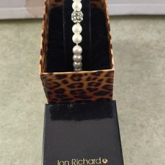 Boxed Jon Richard faux pearl stretch bracelet with a central crystal bead