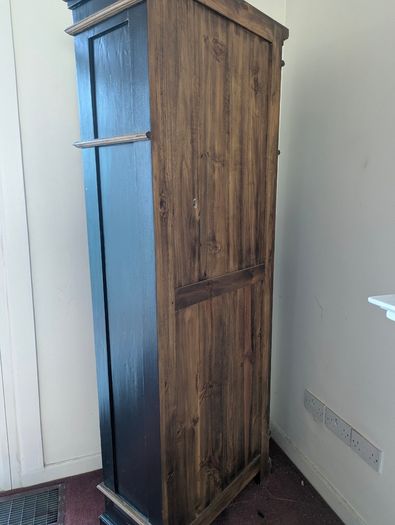 Tall black and wood bookcase