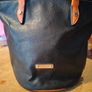 David Jones  is a classic, two-tone black pebbled Faux leather bucket bag. Image 3