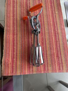 Vintage whisk , steel with orange bakelite handle
