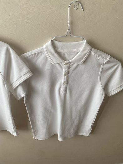 2 dunnes white polo shirts (as new) age 9-10