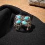 silver tone butterfly cuff bracelet featuring faux turquoise stones and intricate wire work. Image 4