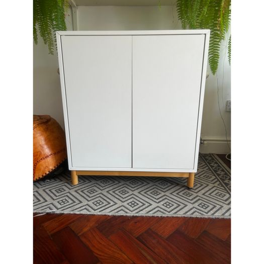 White IKEA cupboard on legs