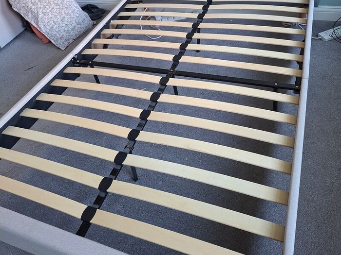 Standard double bed with cream headboard