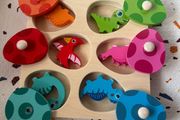 wooden dinosaurs and egg puzzle