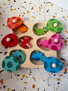 wooden dinosaurs and egg puzzle