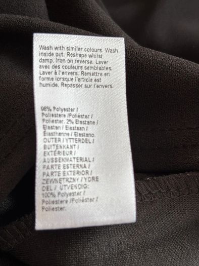 Top with cape-style overlay