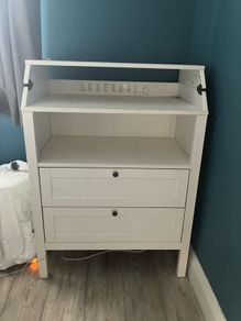 White baby changing table.