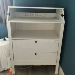 White baby changing table.