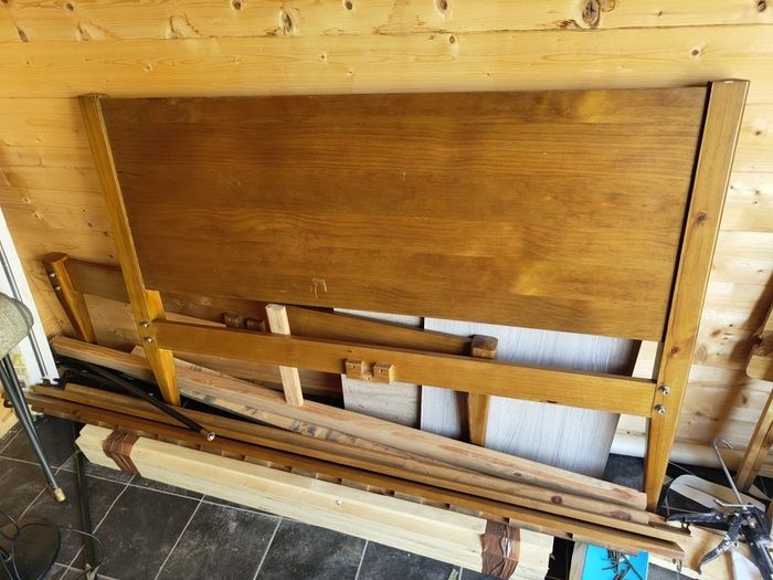 Varnished pine double bed frame.