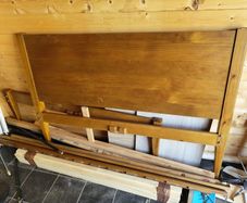 Varnished pine double bed frame.
