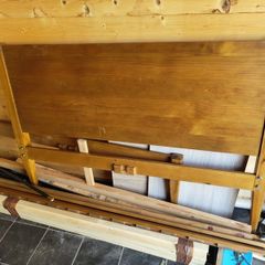 Varnished pine double bed frame.