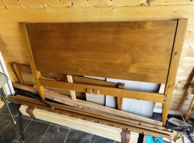 Varnished pine double bed frame.