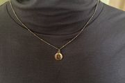 Gold tone rustic chain necklace with Gemini sigh