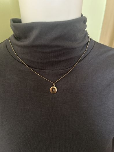 Gold tone rustic chain necklace with Gemini sigh