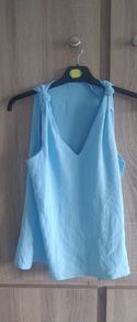 New blue top with knot Fits size 6 8 10