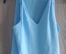 New blue top with knot Fits size 6 8 10