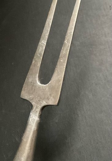 vintage meat carving fork is made of solid steel with a wooden handle and guard possible 1966 British army