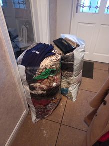 woman's clothes and bags
