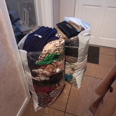 woman's clothes and bags
