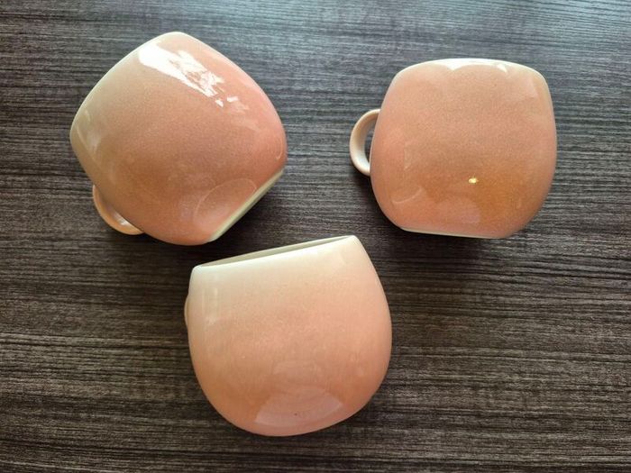 three round pink cups