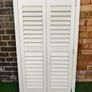 Vintage-style louvered white internal window shutter Image 2