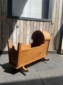 A 19th century style pine baby's rocking cradle.