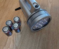 Handheld LED spotlight with batteries