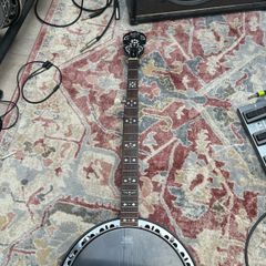 5 String banjo - with picking and sliding capo for high G string.
