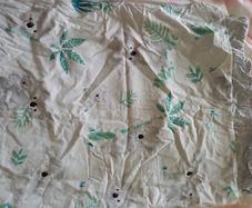 2 x cotbed size duvets from Aldi with sheet and waterproof sheets