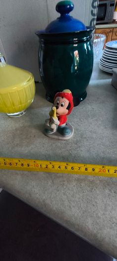 3 spreat items- Vintage Disney Mickey Mouse Figurine Fire Chief Fireman Hydrant Hose 3.5 inchs Korea 12.00 euro. 2 -  Denby Metz Storage Jar + Lid 38.00 euro. 3 - Candy, sugar, or trinkets yellow, ribbed glass storag and lid 32.00 euro.