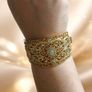 Stunning Royal Gold Plated Cuff Bracelet Intricate Filigree Green Stones. Image 2