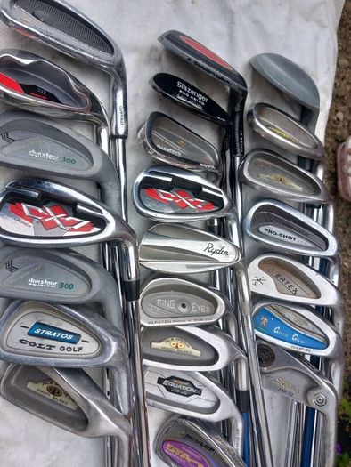 A selection of golf clubs and bags. NOT SELLING SEPARATE