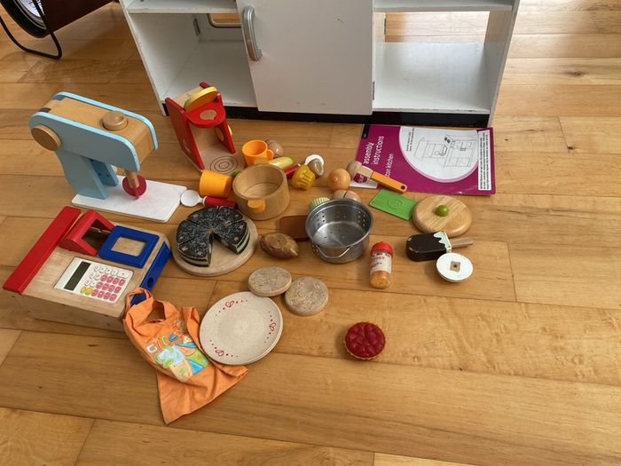 kids play kitchen by Plum with wooden food accessories