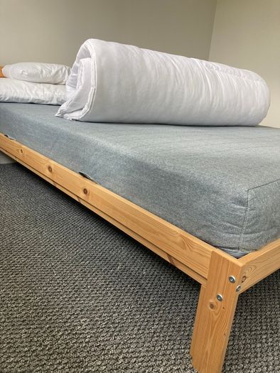 Light pine double bed and mattress from IKEA