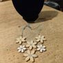 vintage floral piece necklace featuring white, petal-like elements. arranged in a daisy like pattern. Like new Image 3