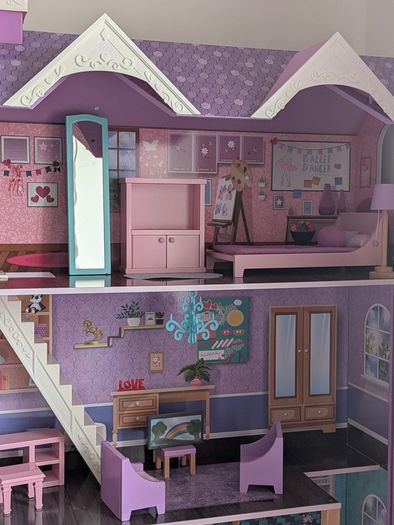 Large wooden dolls house with furniture