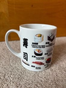 A Mug Featuring Different Types of Sushi