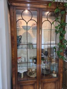 Tall glass crockery unit for sale