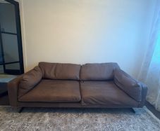 Leather sofa with original harvey Norman tag still attached