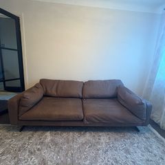 Leather sofa with original harvey Norman tag still attached