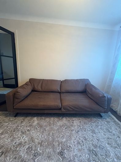Leather sofa with original harvey Norman tag still attached