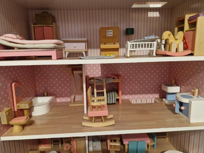 Wooden dolls house with furniture