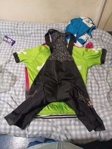 2 cycling shirts 1 is cube worth easily 50 euro and is brand new and pants with padding for on the saddle brand new never worn the second shirt is the official astana team training shirt also brand new  is the  would like to sell all together for a good p